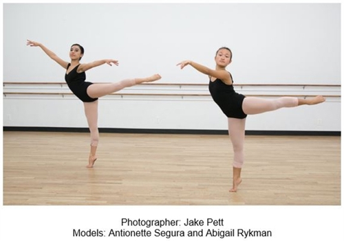 Two dancers in arabesque